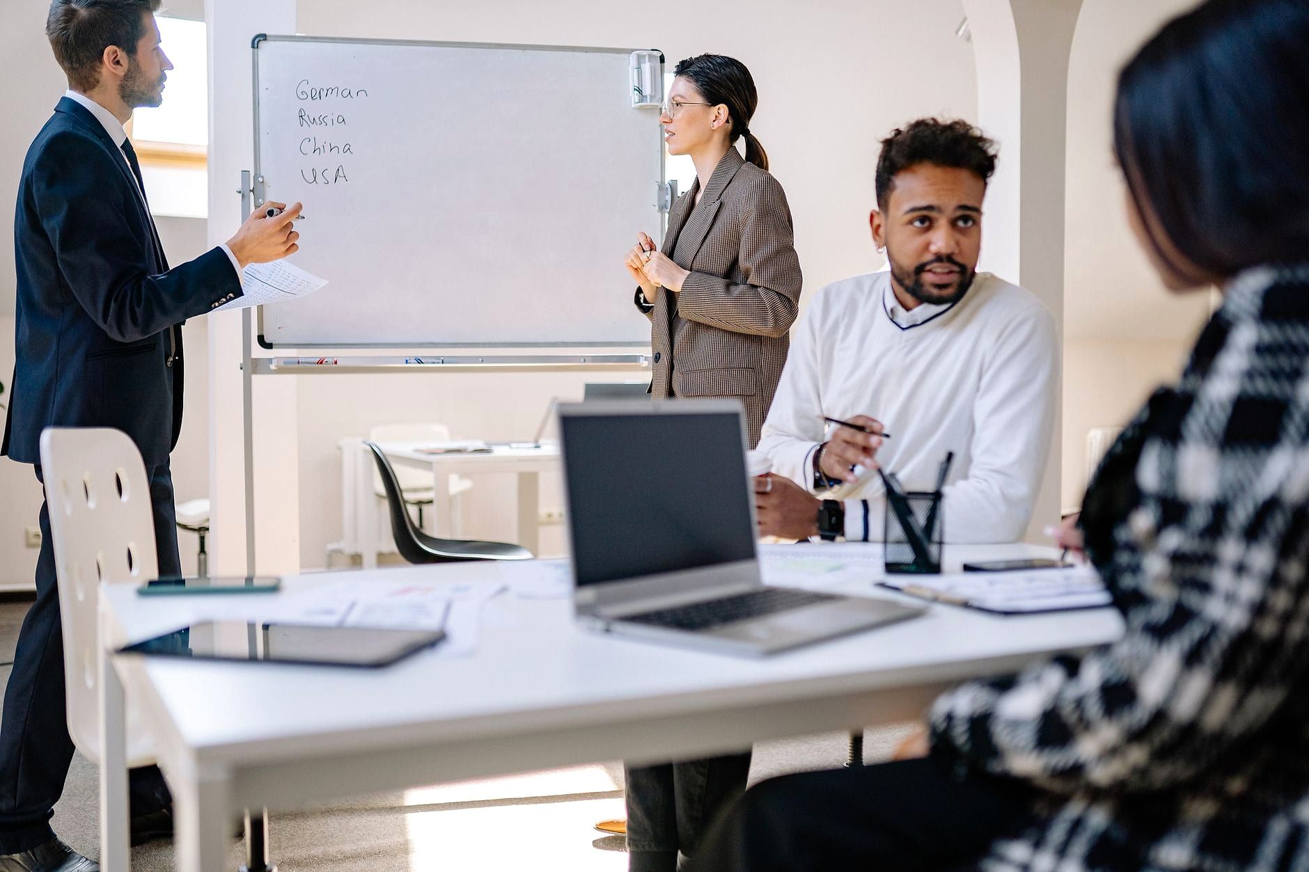 A professional team in a meeting around a table.